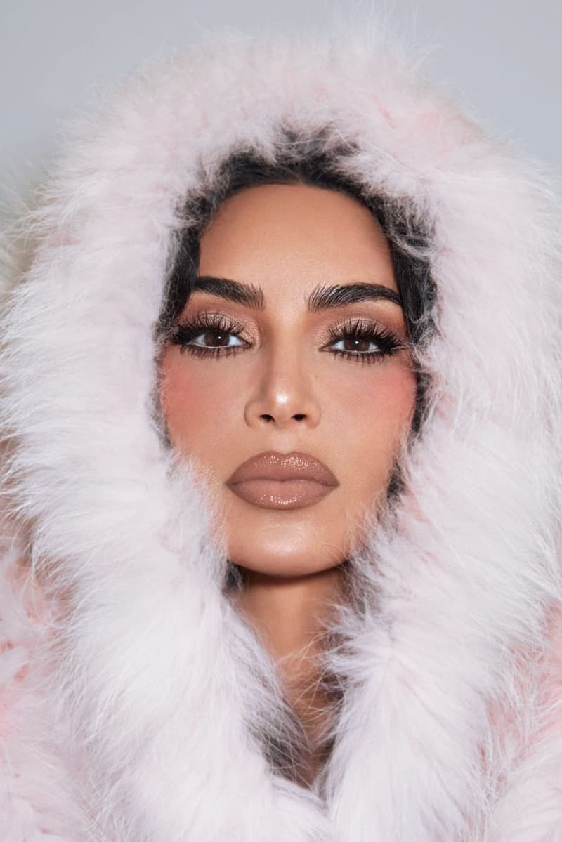 kim kardashian wearing gold eyeshadow, a nude lipstick and a furry coat, new holiday makeup launch, skkn by kim