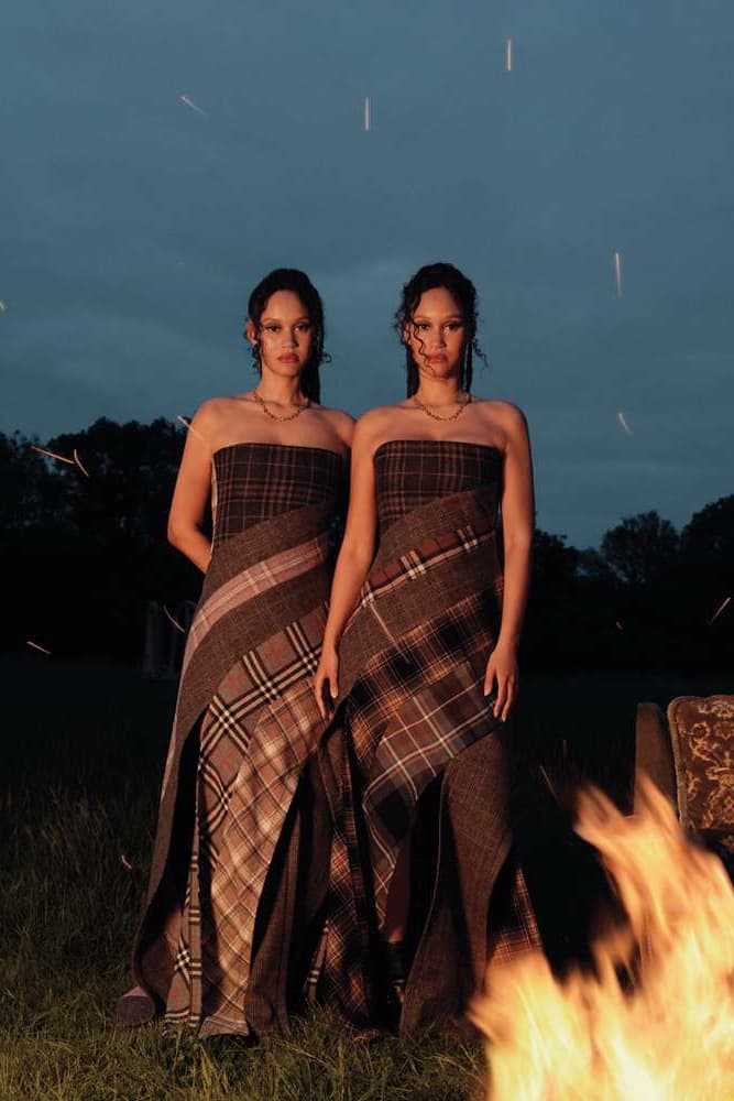 two twins posing together in grassy forest sharing a coat, byredo holiday, fragrance, makeup, perfume 